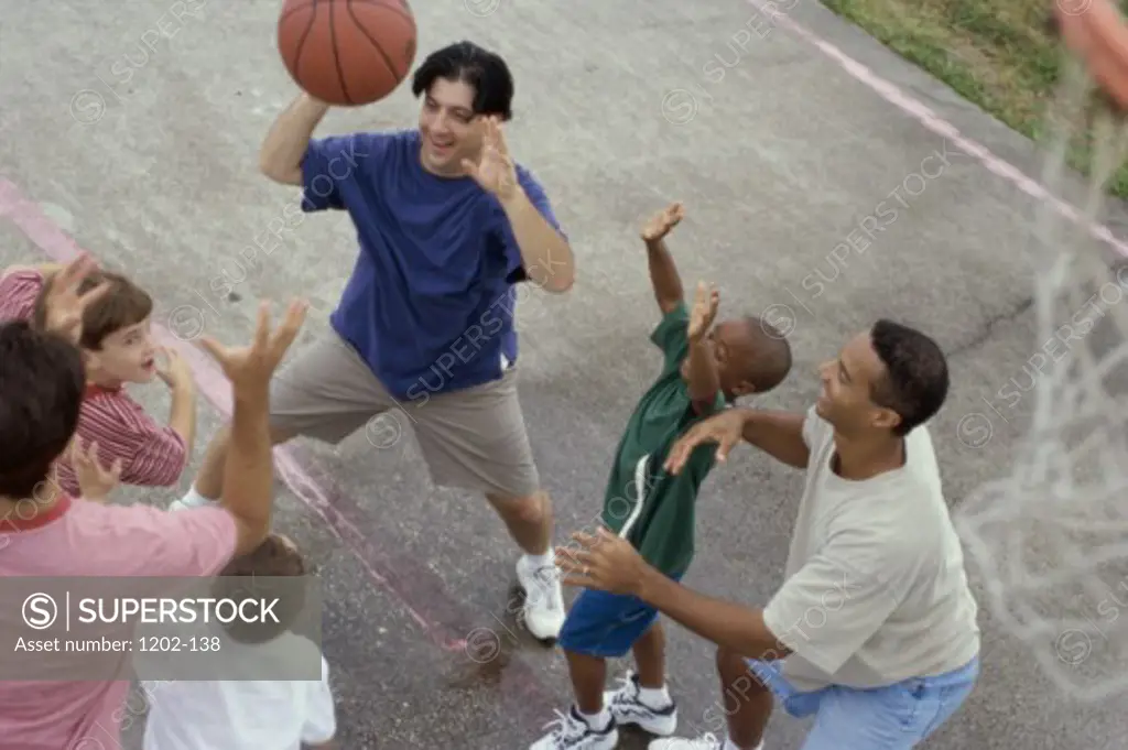 High angle view of a group of people playing basketball