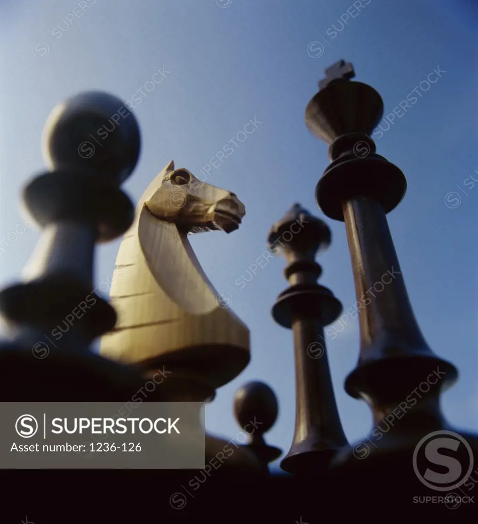 Low angle view of chess pieces - SuperStock