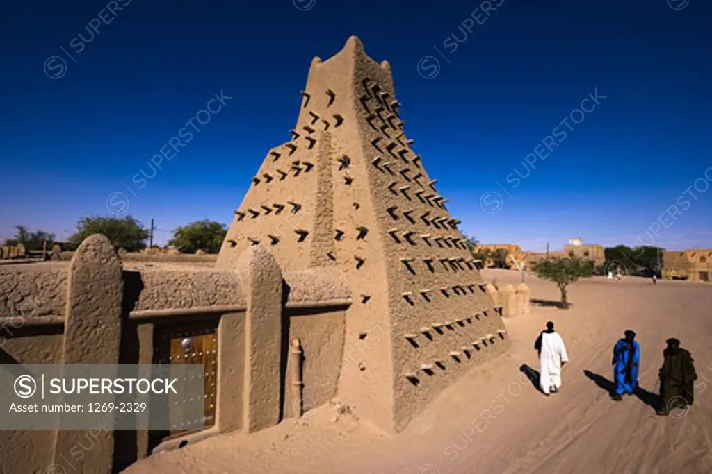 People walking near a mosque, Sankore Mosque, Timbuktu, Mali