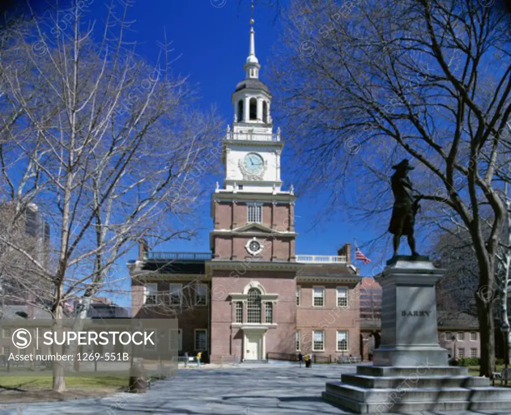 Statue in front of a clock tower, Independence Hall, Independence National Historical Park, Pennsylvania, USA