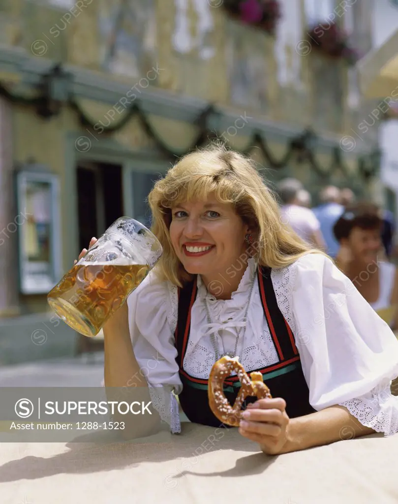 Portrait of a young woman drinking beer, Bavaria, Germany