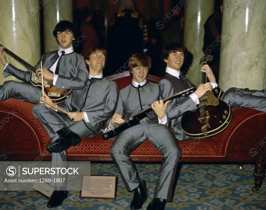 Statues of musicians in a museum, The Beatles, Madame Tussauds, London, England