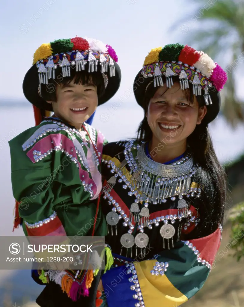 Portrait of a mother and her daughter dressed in traditional clothing, Golden Triangle, Thailand