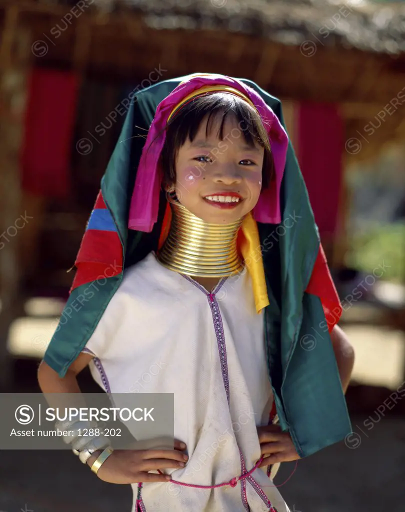 Portrait of a Karen girl dressed in traditional clothing smiling, Mae Hong Son, Golden Triangle, Thailand