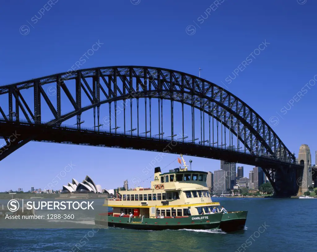 Low angle view of a bridge across a harbor, Sydney Harbor Bridge, Sydney, New South Wales, Australia