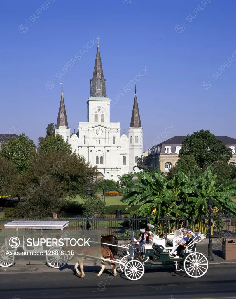 Tourists traveling in a carriage, St. Louis Cathedral, New Orleans, Louisiana, USA