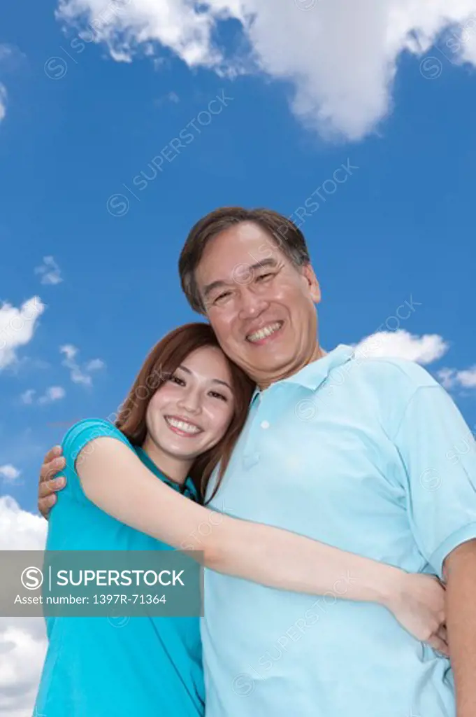 Daughter bonding with father and smiling together