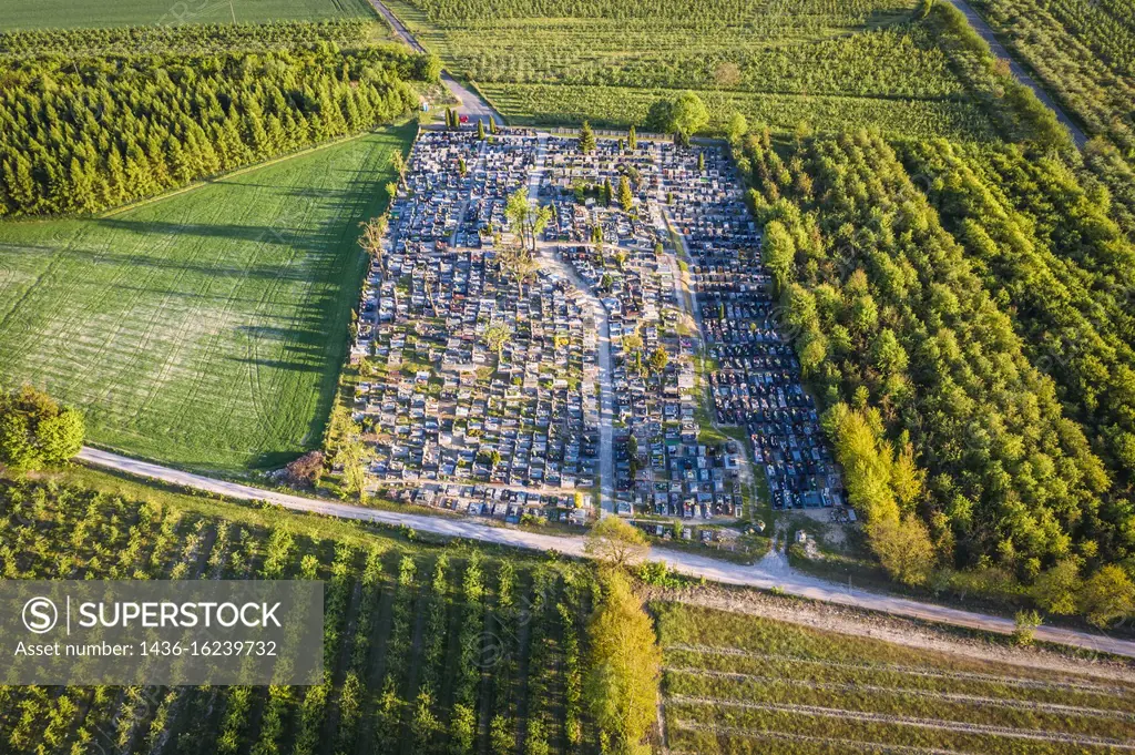 Aerial view with cemetery in Rogow village in Brzeziny County, Lodzkie Voivodeship in central Poland.