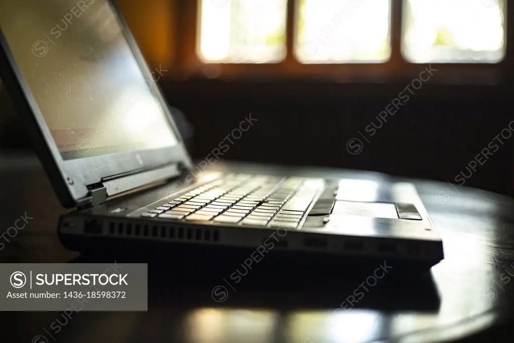 Detail of Laptop on table in a office.