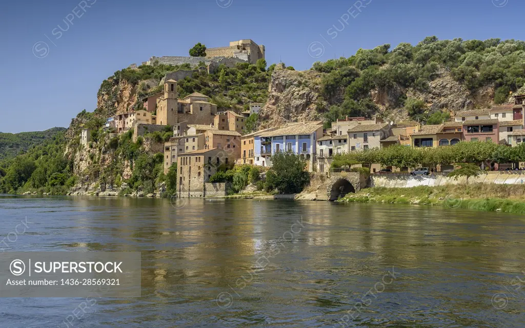 Miravet village and castle seen from the jetty on the Ebro river (Ribera d'Ebre, Tarragona, Catalonia, Spain).