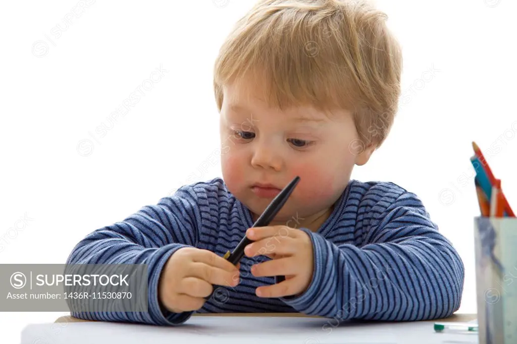 little boy with pen on white background.