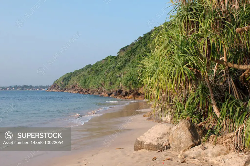 rocky shore on ""Jungle Beach"", Hikkaduwa, Sri Lanka, South Asia.