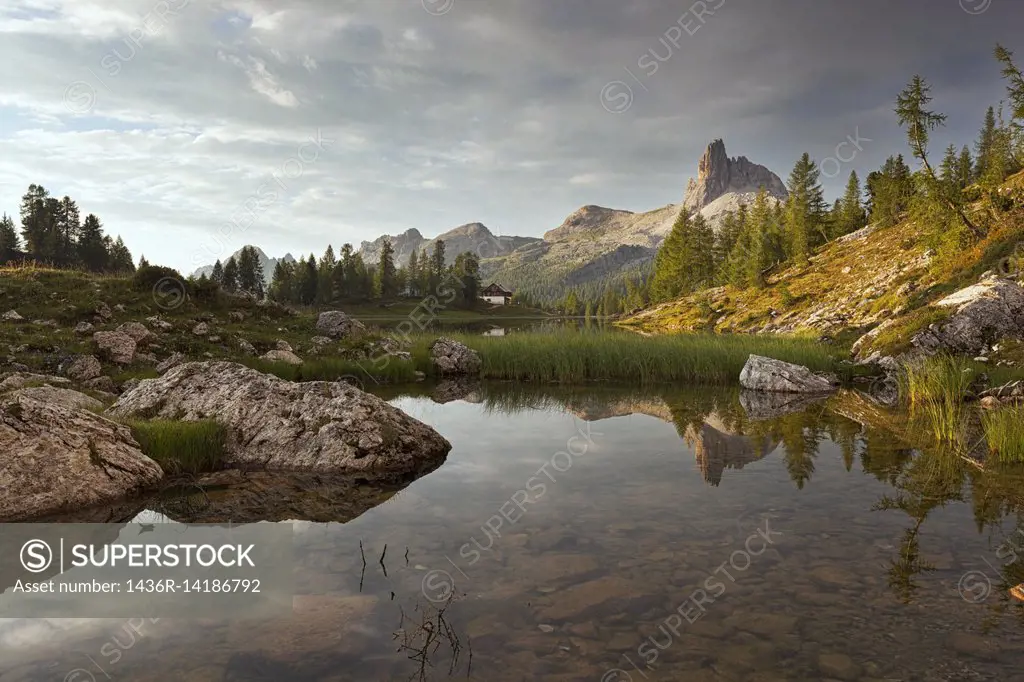 Dawn at Federa Lake with Becco di Mezzodì, Croda da Lago, Dolomites, Cortina d'Ampezzo, Veneto, Italy.