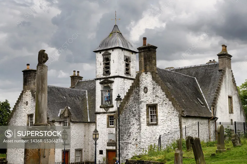 17th Century Burgh architecture of Cowanes Hospital with statue of John Cowane at Holy Rude Old Town cemetery on Castle Hill of Stirling Scotland.