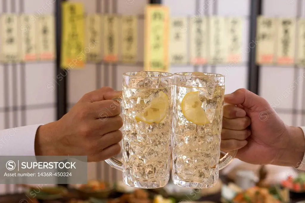 Two People Toasting with Whisky and Soda at Izakaya