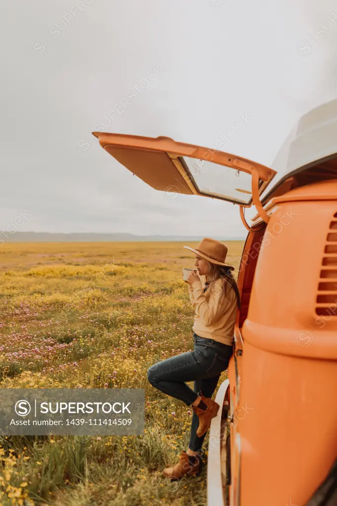 Woman on road trip in countryside