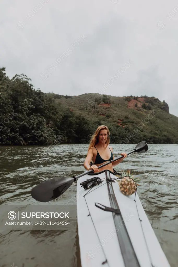 Woman kayaking, Princeville, Hawaii, US