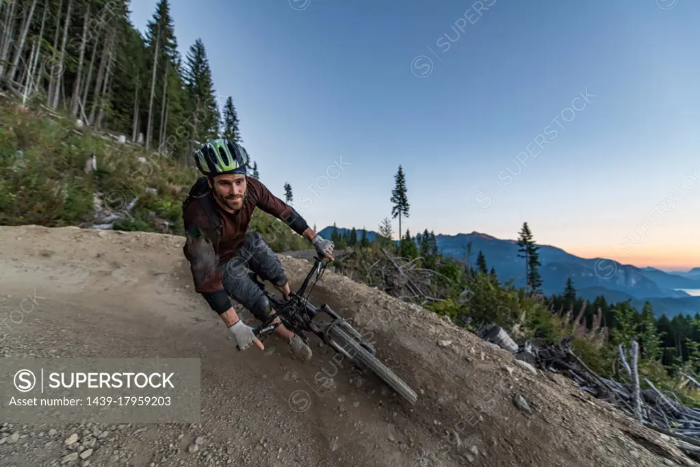 Mountain biker on hill, Squamish, British Columbia, Canada