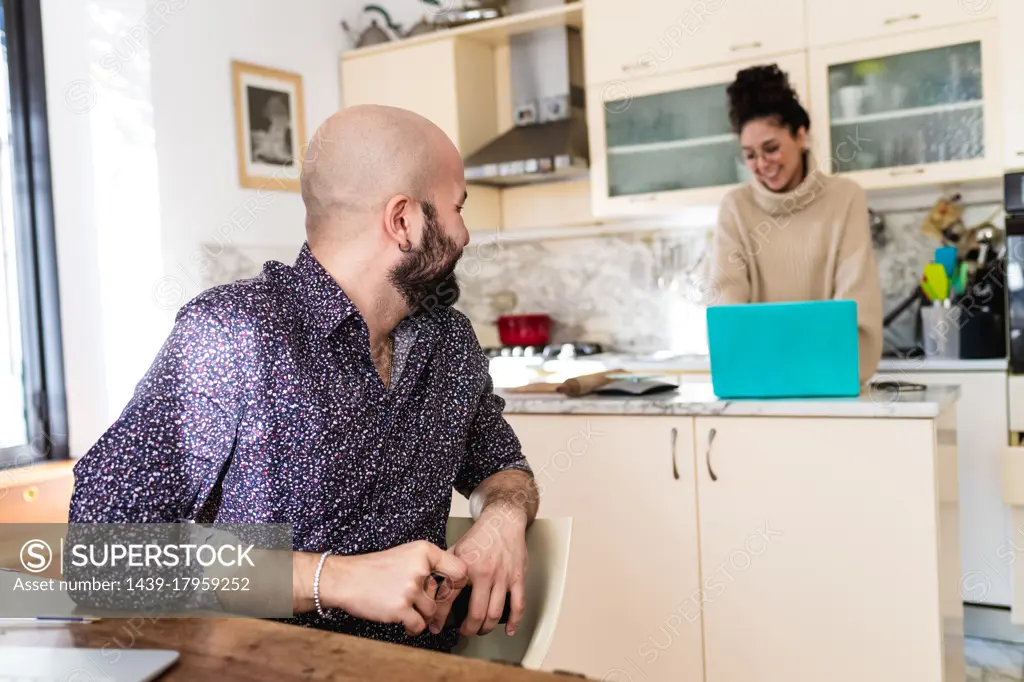 Young couple in kitchen at home