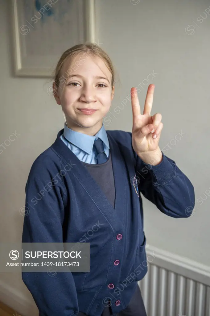 UK, Surrey, Portrait of smiling girl in school uniform