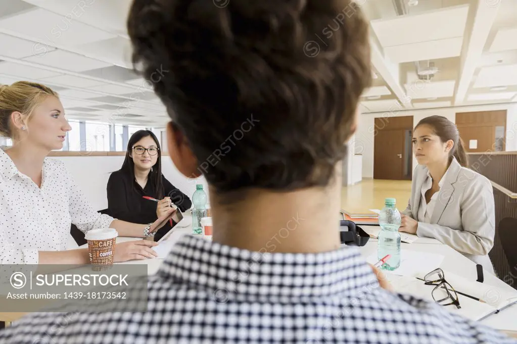 Germany, Bavaria, Munich, People at business meeting in office