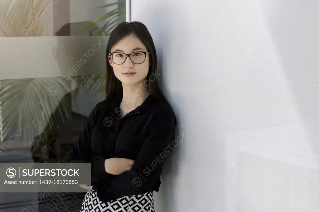 Germany, Bavaria, Munich, Portrait of young businesswoman in office