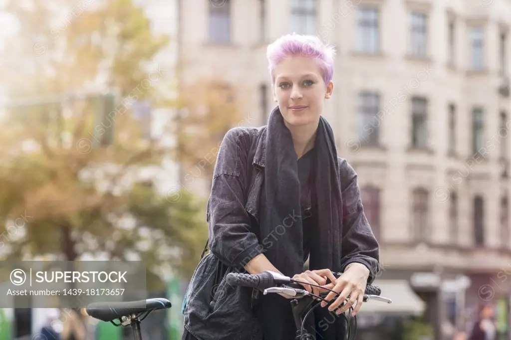 Portrait of young woman on city street