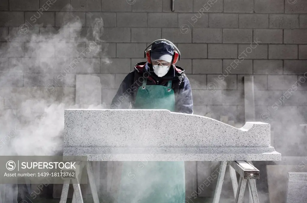 Italy, Premosello Chiovenda, Verbania, Man working with stone