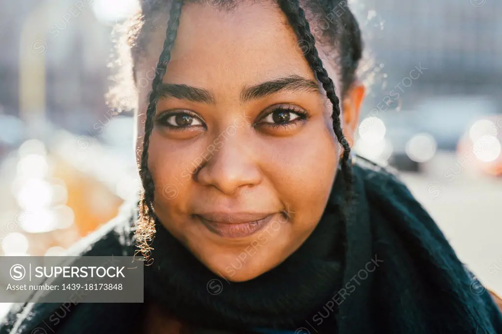 Portrait of smiling young woman outdoors