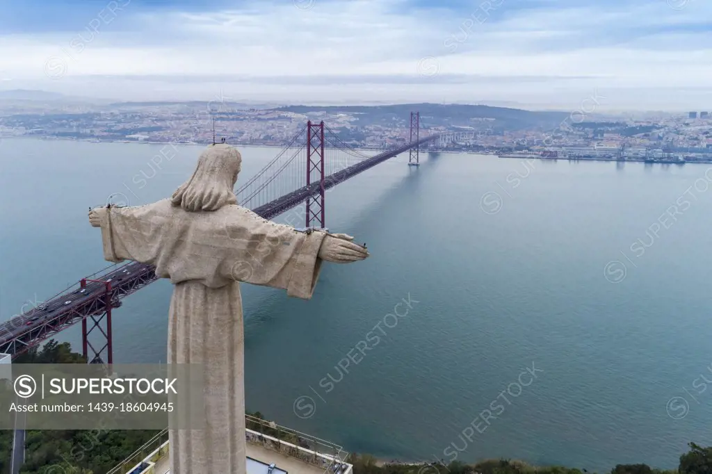 Portugal, Lisbon, Christ the King statue and 25 de Abril Bridge