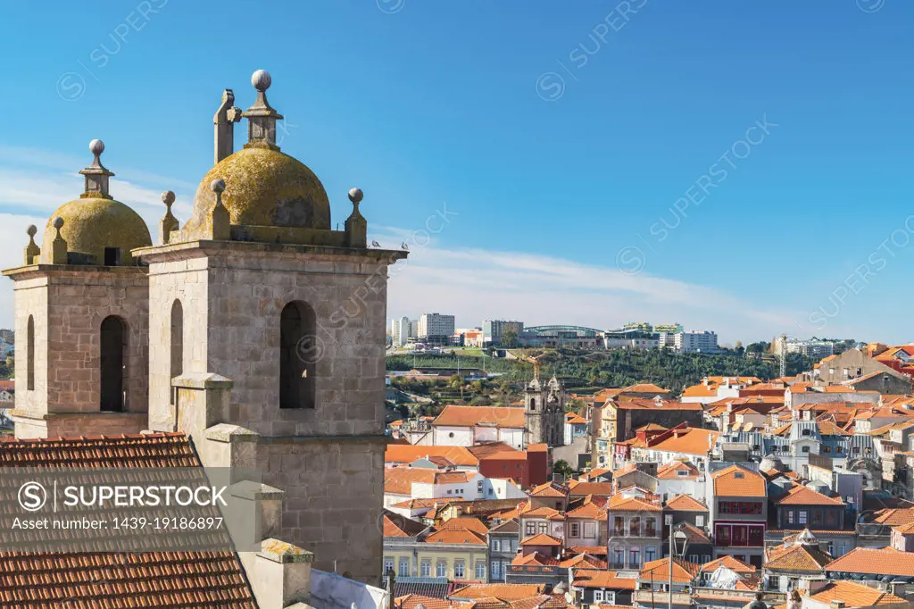 Portugal, Porto, Towers of Dos Grilos church and old town rooftops