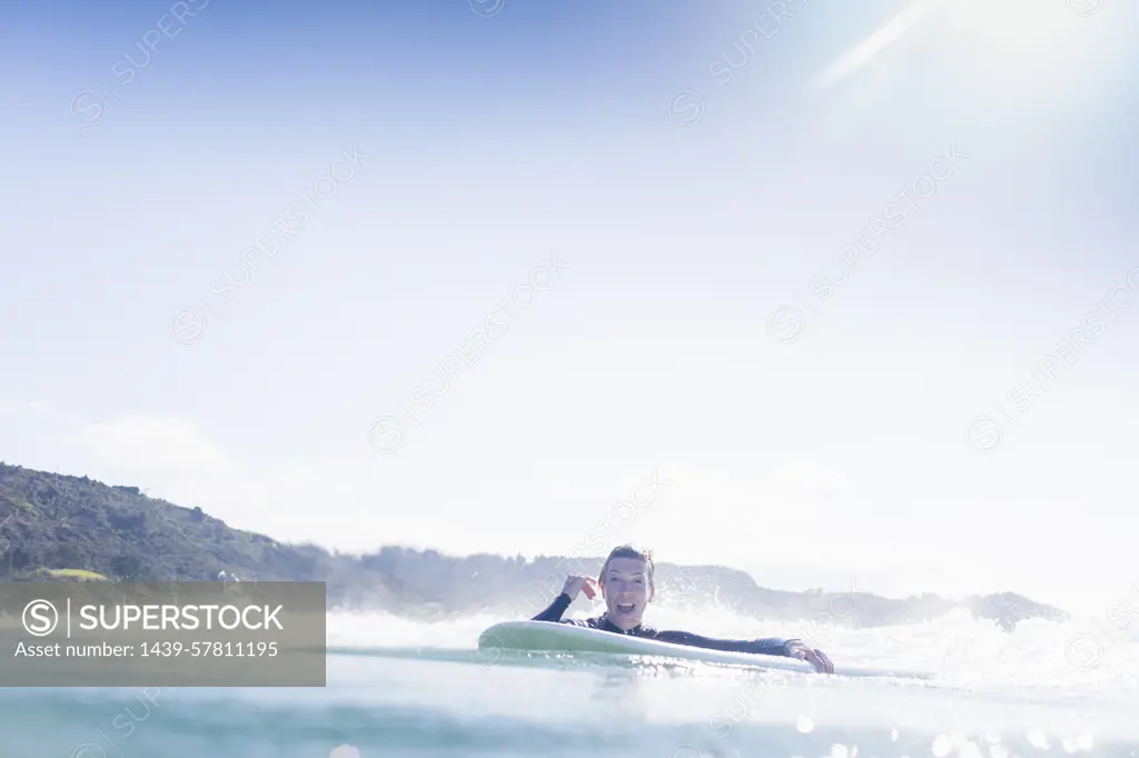 Surfer in the water, Bay of Islands, New Zealand