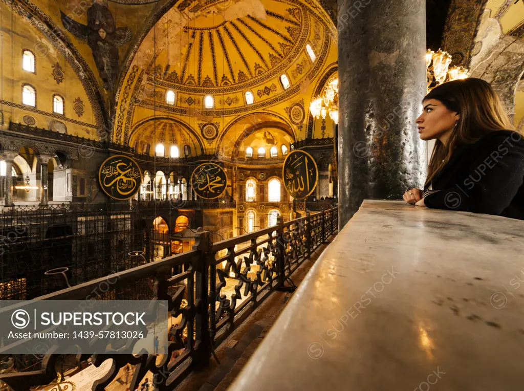 Young woman inside Hagia Sophia mosque, Istanbul, Turkey