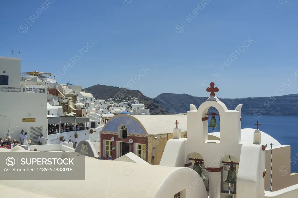 View of rooftops and whitewashed church, Oia, Santorini, Greece