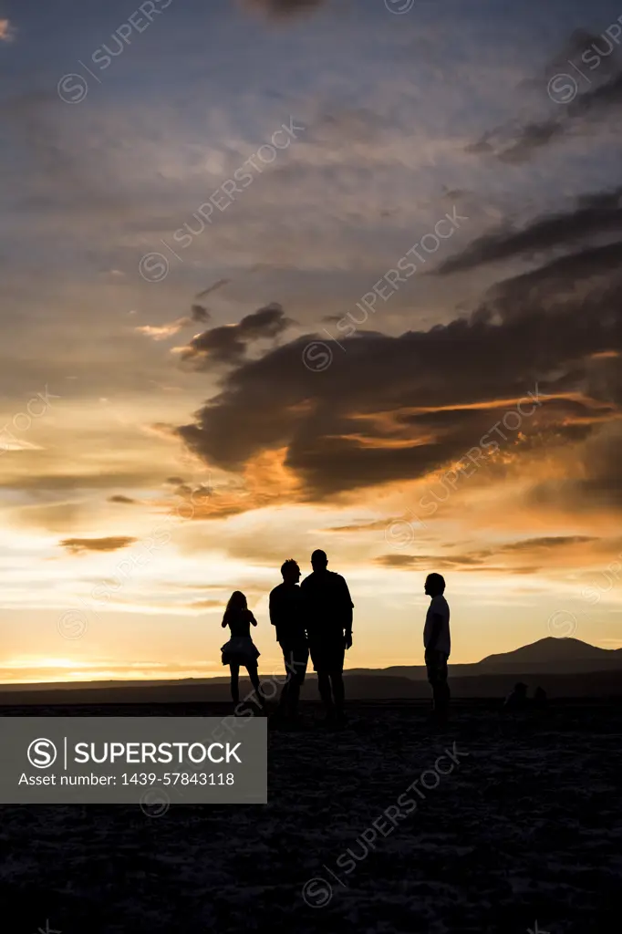 Silhouette of people in desert at sunset, San Pedro de Atacama, Chile