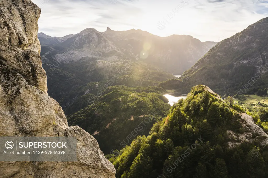 Sunlit mountain valley landscape and rock formations,  Futaleufu, Los Lagos region, Chile