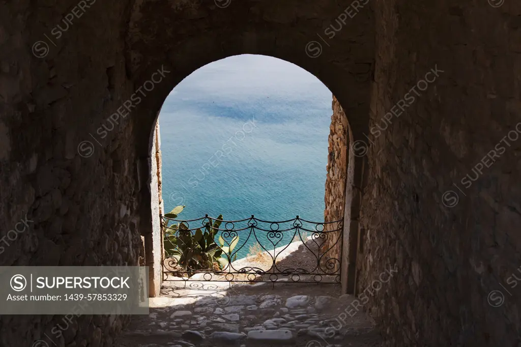 Archway view of blue sea, Nafplio, Greece