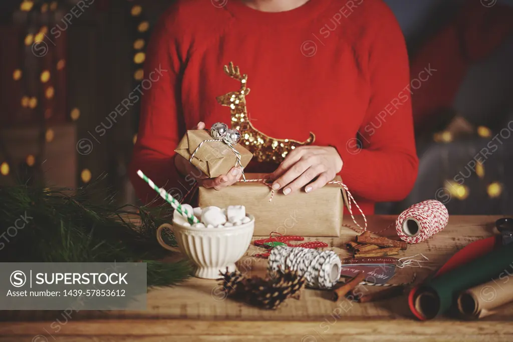 Woman wrapping christmas gifts