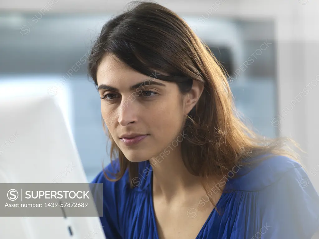 Woman working at computer in office