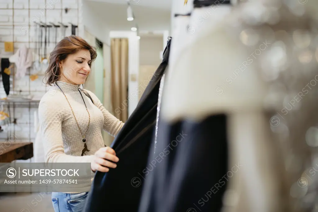 Woman shopping in fashion boutique