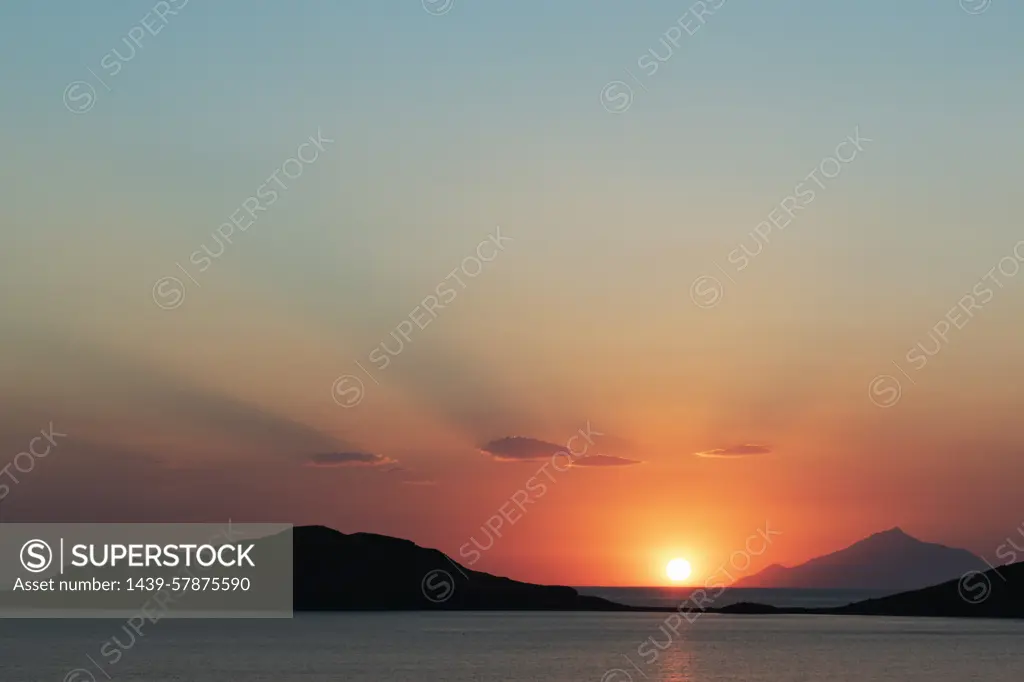 Scenic sunset over coastal mountains, Limnos, Khios, Greece