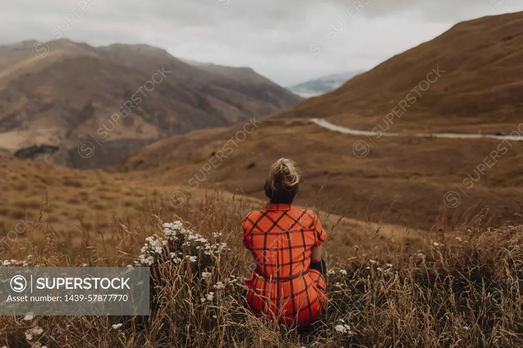 Woman enjoying view of scenic landscape, Queenstown, Canterbury, New Zealand