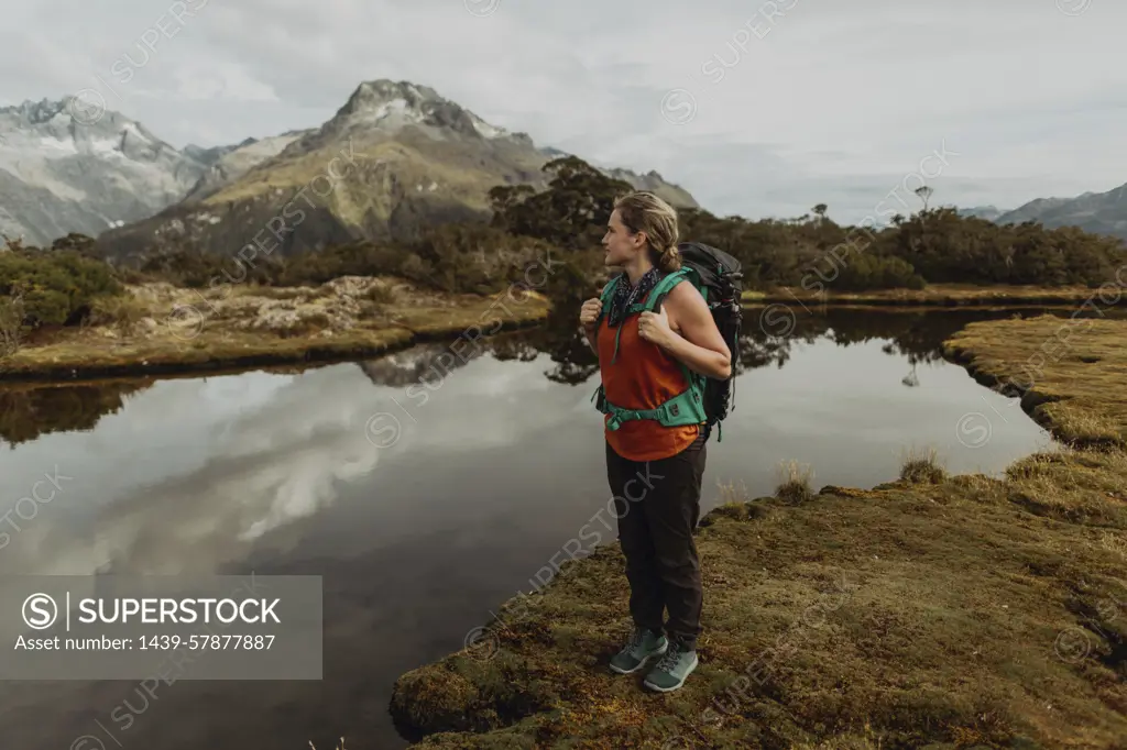 Hiker enjoying scenic lake view, Queenstown, Canterbury, New Zealand