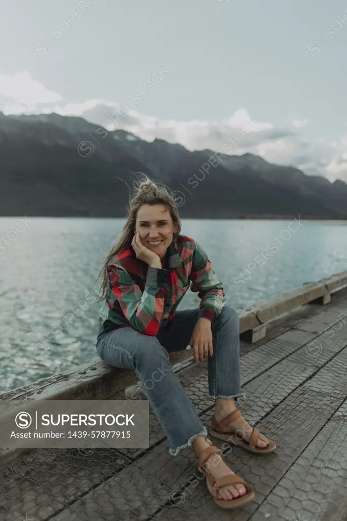 Woman enjoying scenic lake view, Queenstown, Canterbury, New Zealand