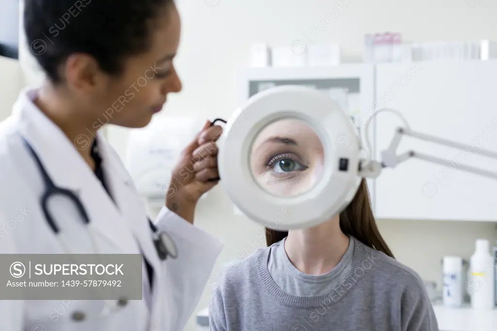 Doctor giving patient eye test