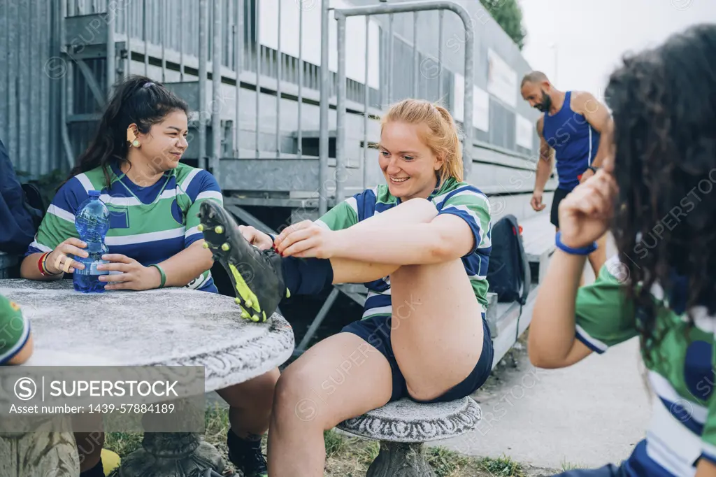 Teammates sharing a laugh during a rugby break