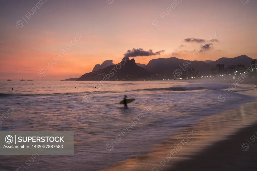 Brazil, Rio de Janeiro, Beach and sea waves at sunset