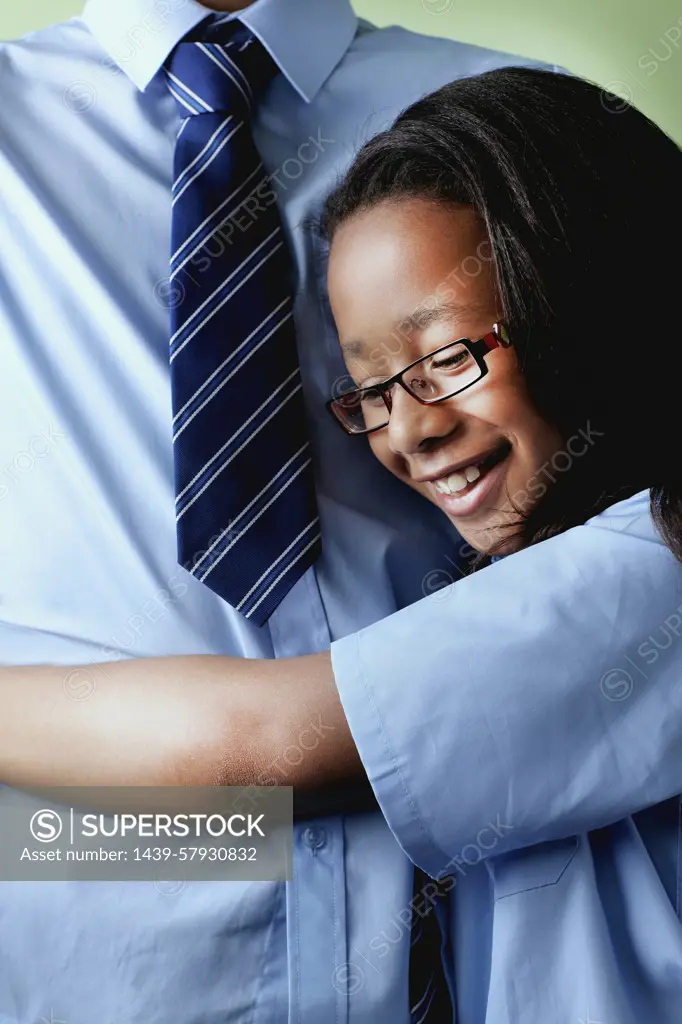 Schoolgirl hugging brother