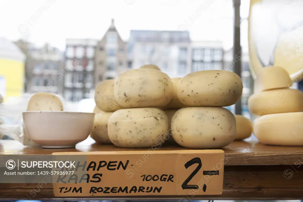 Round cheeses in shop window, Amsterdam, Netherlands