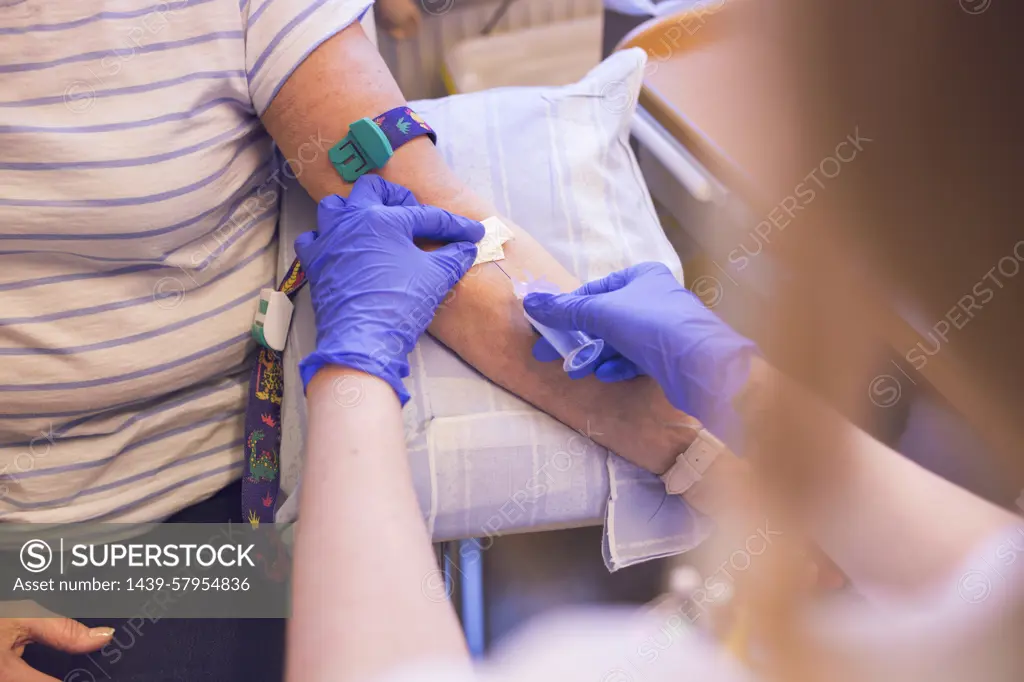 A patient receiving a blood test in a medical setting